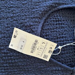 New, never worn.  Stretchy easy top